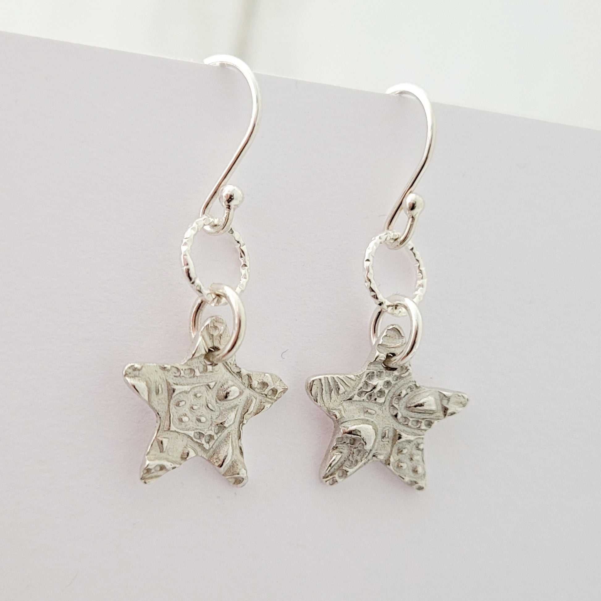 Sterling-silver-textured-star-drop-earrings-3