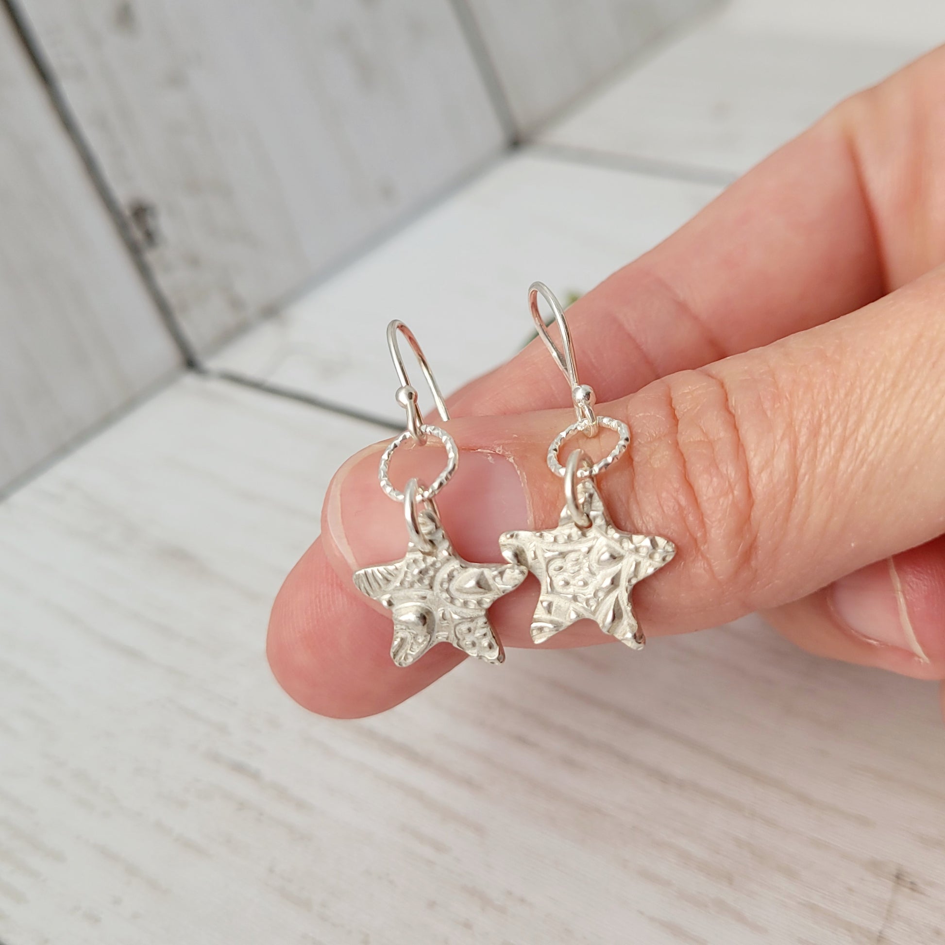 Sterling-silver-textured-star-drop-earrings-5