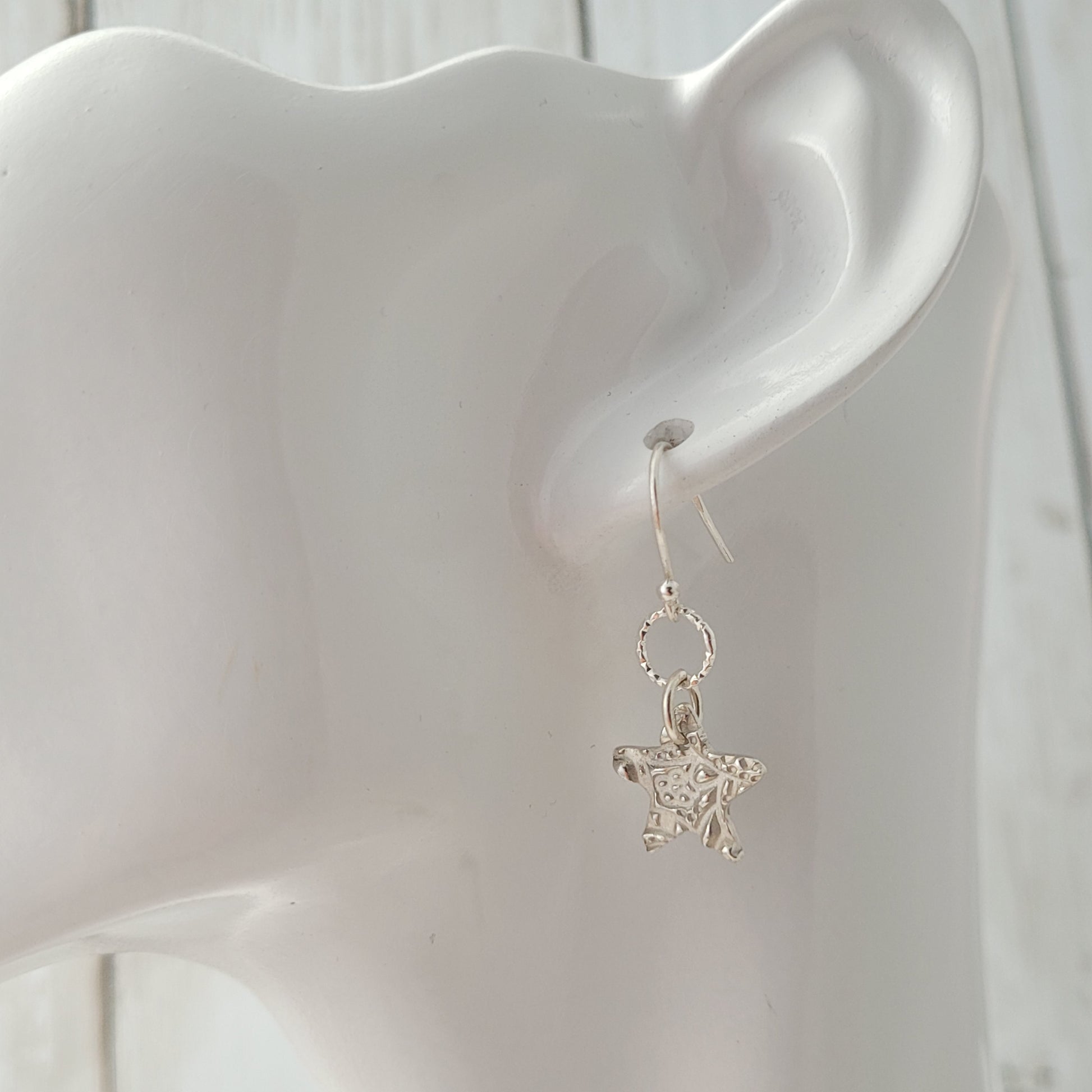 Sterling-silver-textured-star-drop-earrings-4