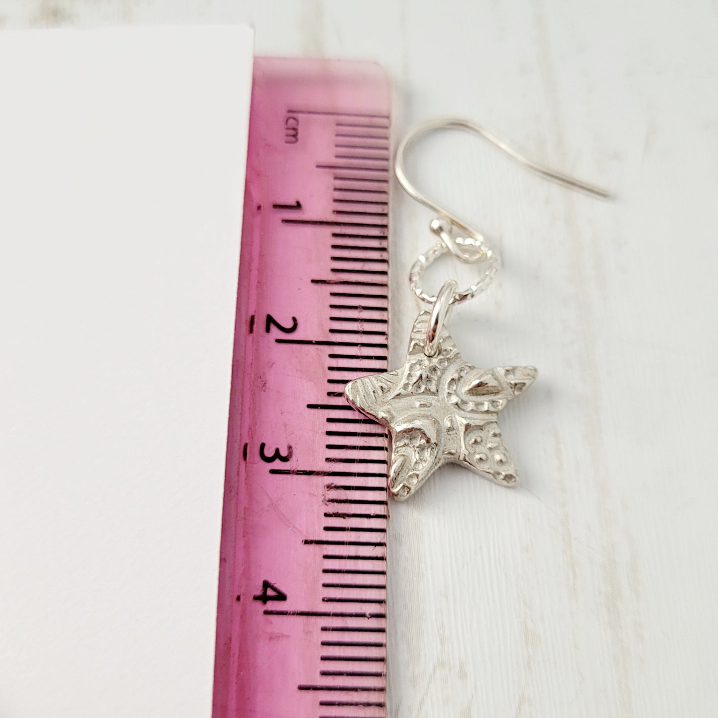 Sterling-silver-textured-star-drop-earrings-6